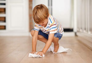 Kid cleaning floor | Hernandez Wholesale Flooring