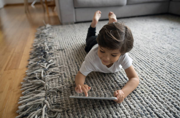 Girl laying on rug | Hernandez Wholesale Flooring