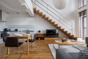 Bright open concept living room with laminate flooring