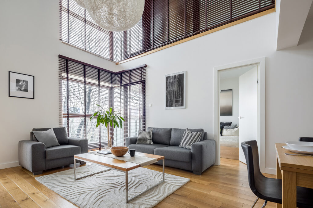 Large area rug protecting hardwood style flooring