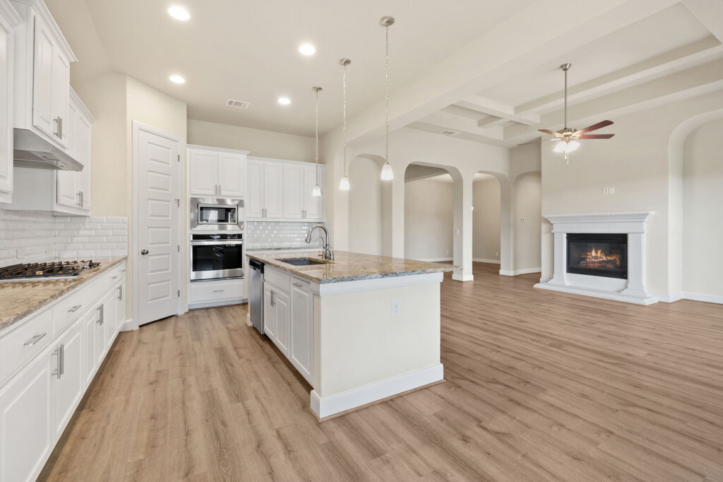 Laminate flooring connecting a living room and dining area in a bright California home