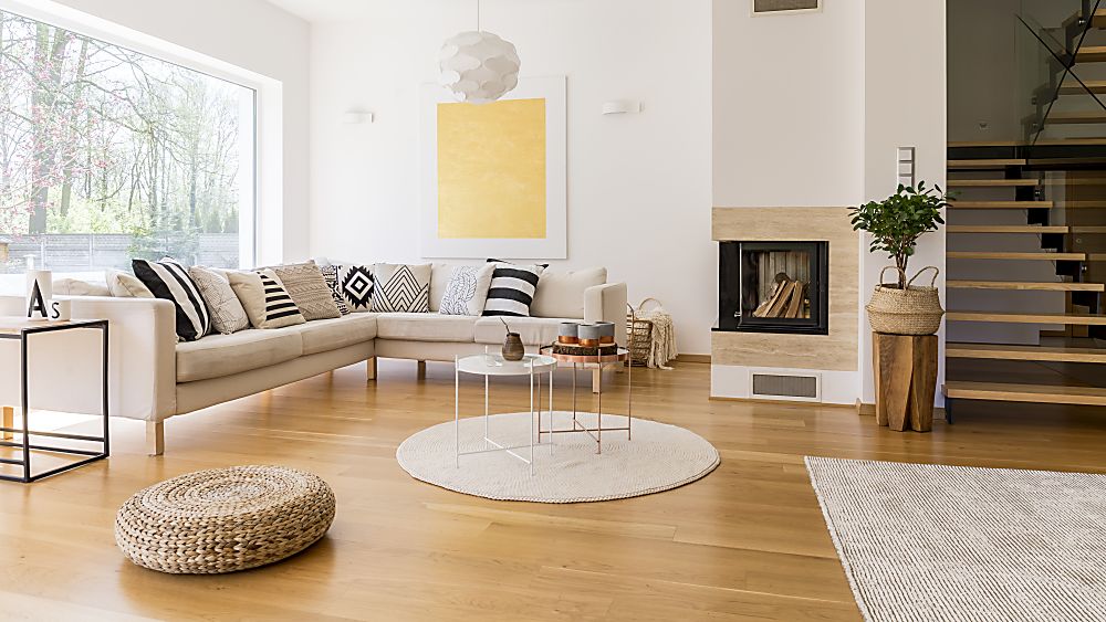 Area rugs defining living and dining spaces in an open concept California home